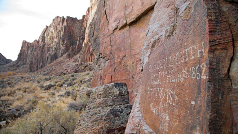 pioneer graffiti on rock wall at high rock canyon