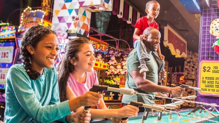 kids playing a squirt gun game at the circus circus arcade