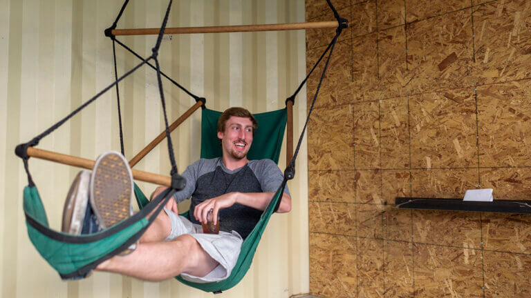 man relaxing on a hammock