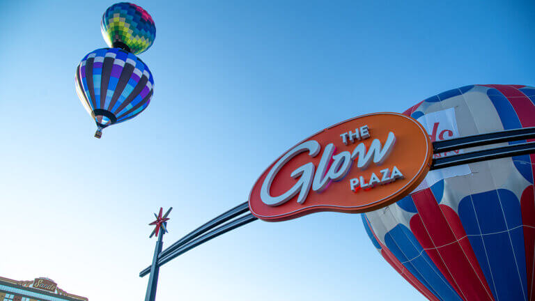 sign for the glow plaza