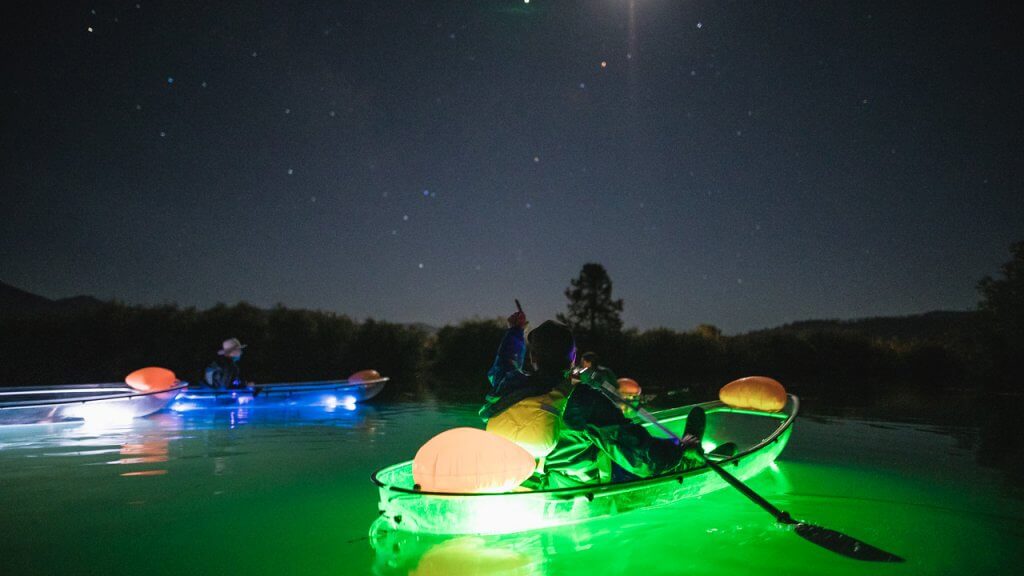 glowing kayaks on tahoe at night