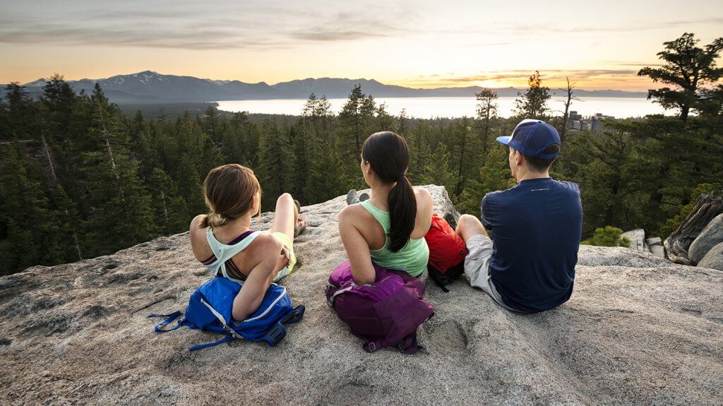 3 hikers watching the sunset at the van sickle bi-state park