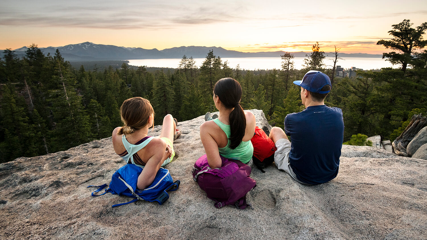 3 hikers watching the sunset at the van sickle bi-state park