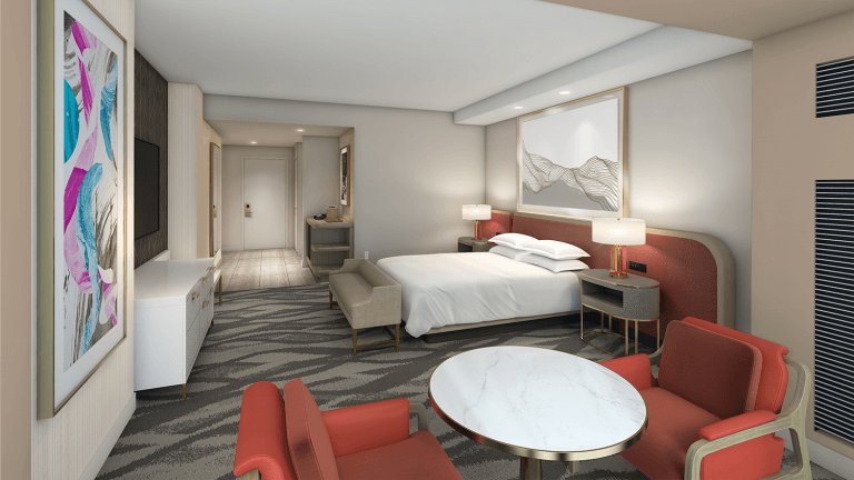 hotel room at resorts world with orange furniture