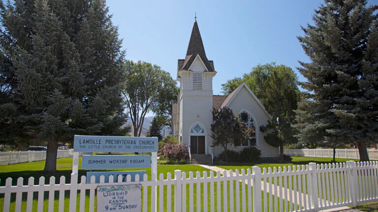 white picket fence at the little church of the crossroads
