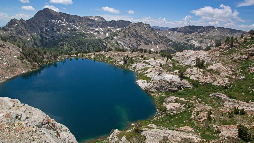 aerial view of mountains and lake at liberty pass