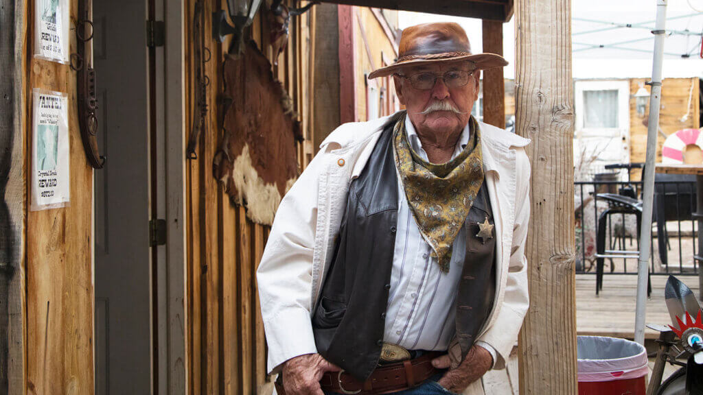 man dressed as a sheriff at the happy burro