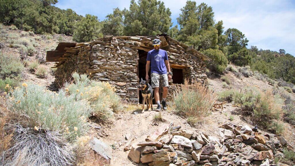 man and dog at ophir mill ghost town