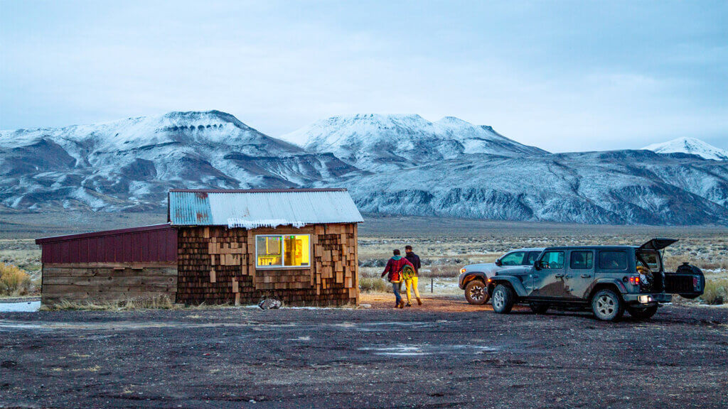 two cars parked in front of soldier meadows blm cabin