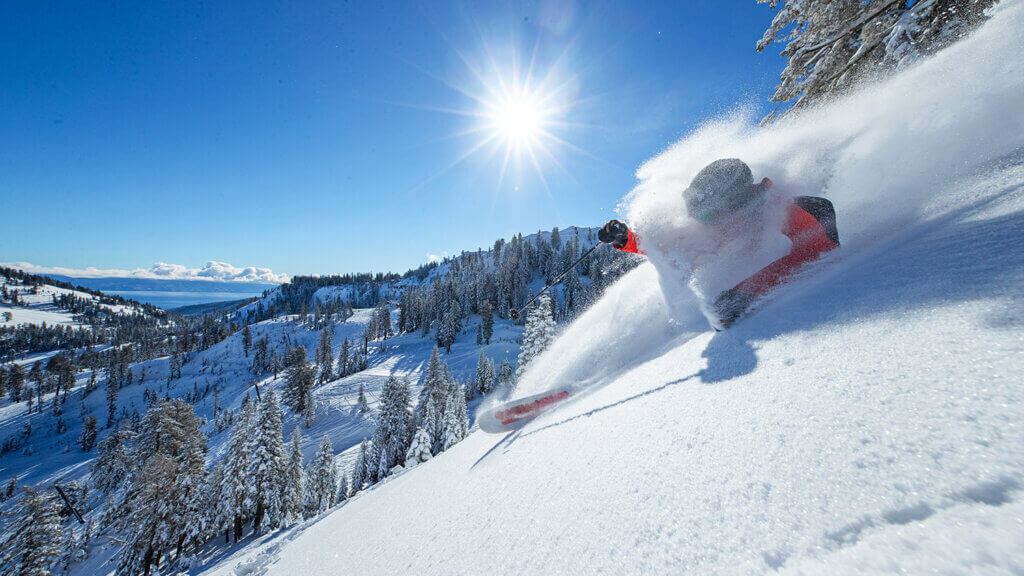 person skiing down a hill at palisades tahoe