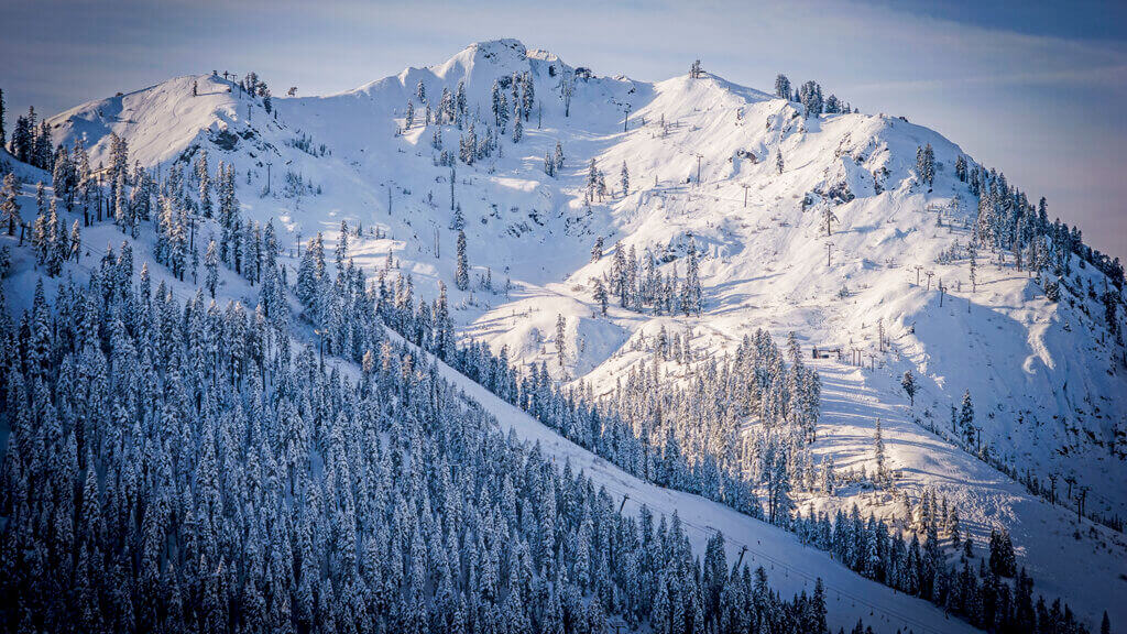 snow covered mountain at palisades tahoe lodge