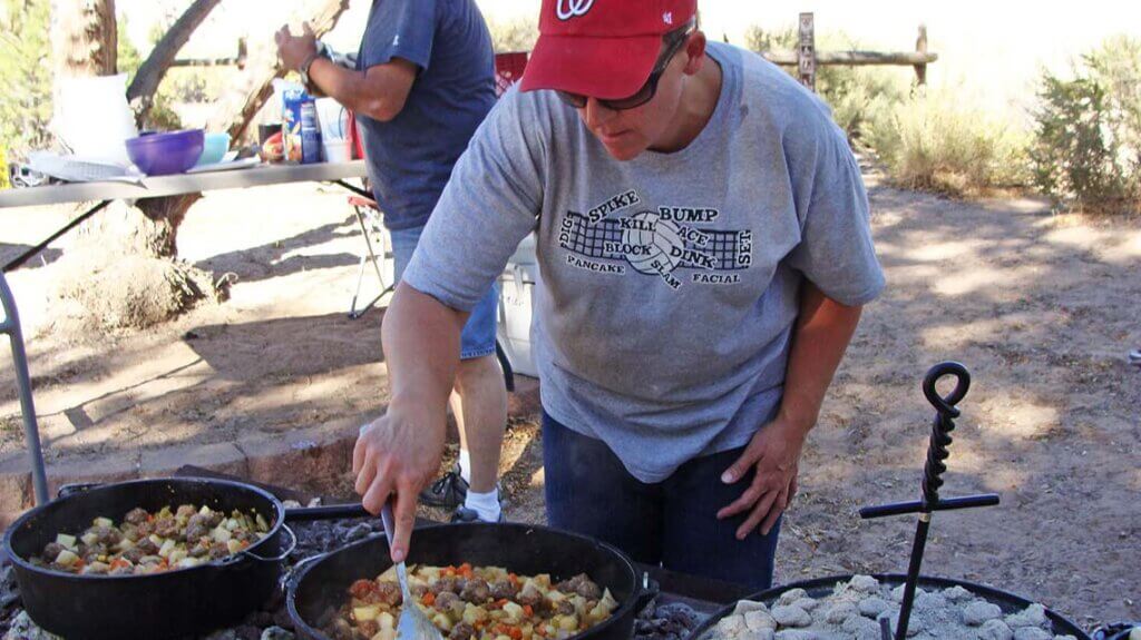 people cooking in dutch ovens