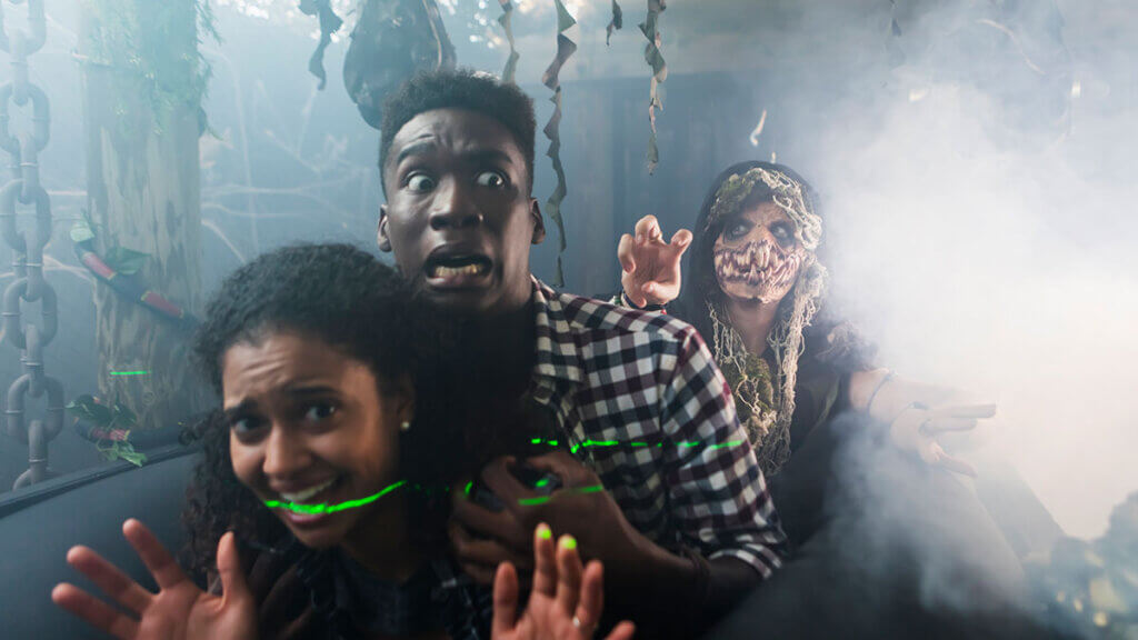 couple being scared at a haunted house