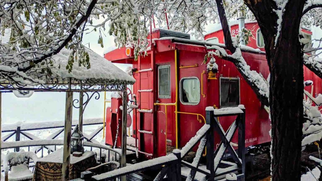 ruby caboose covered in snow