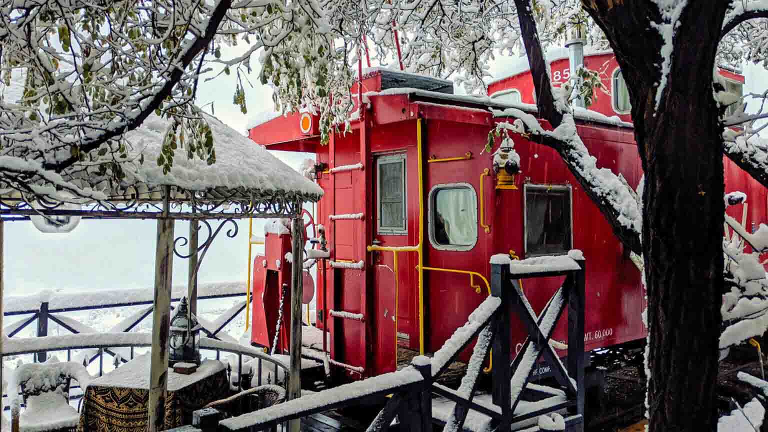 ruby caboose covered in snow