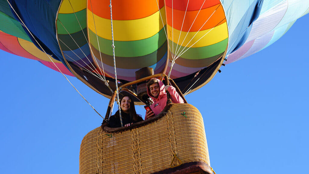 people in a balloon at the mesquite hot air balloon festival in nevada