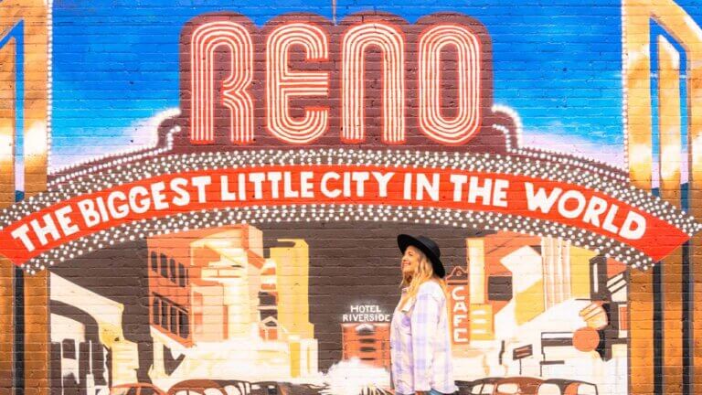 woman in front of reno mural