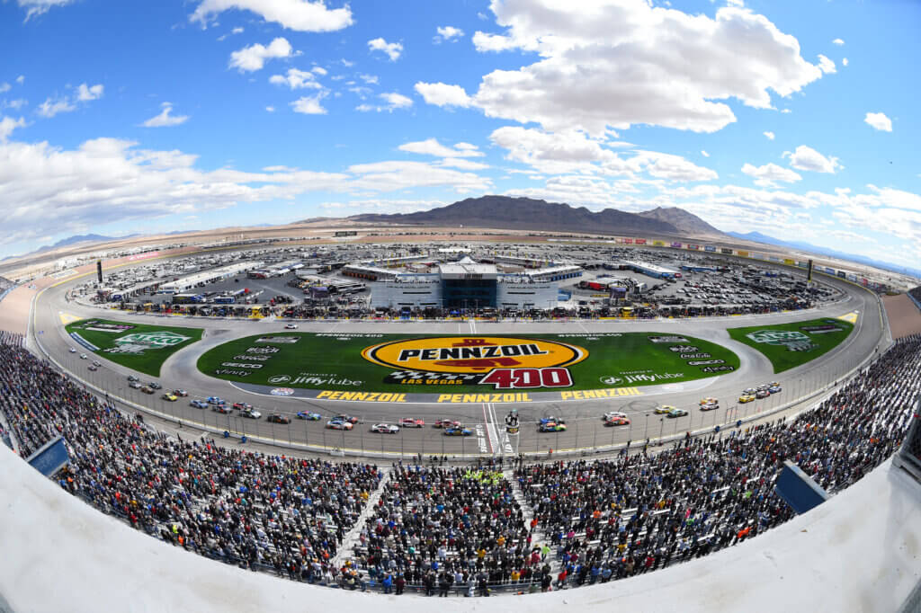 LAS VEGAS, NV - MARCH 06: Christopher Bell (#20 Joe Gibbs Racing DeWalt Toyota) leads the field across the starting line for the start of the race during the NASCAR Cup Series Pennzoil 400 presented by Jiffy Lube on March 06, 2022, at Las Vegas Motor Speedway in Las Vegas, NV. (Photo by Chris Williams/Icon Sportswire)