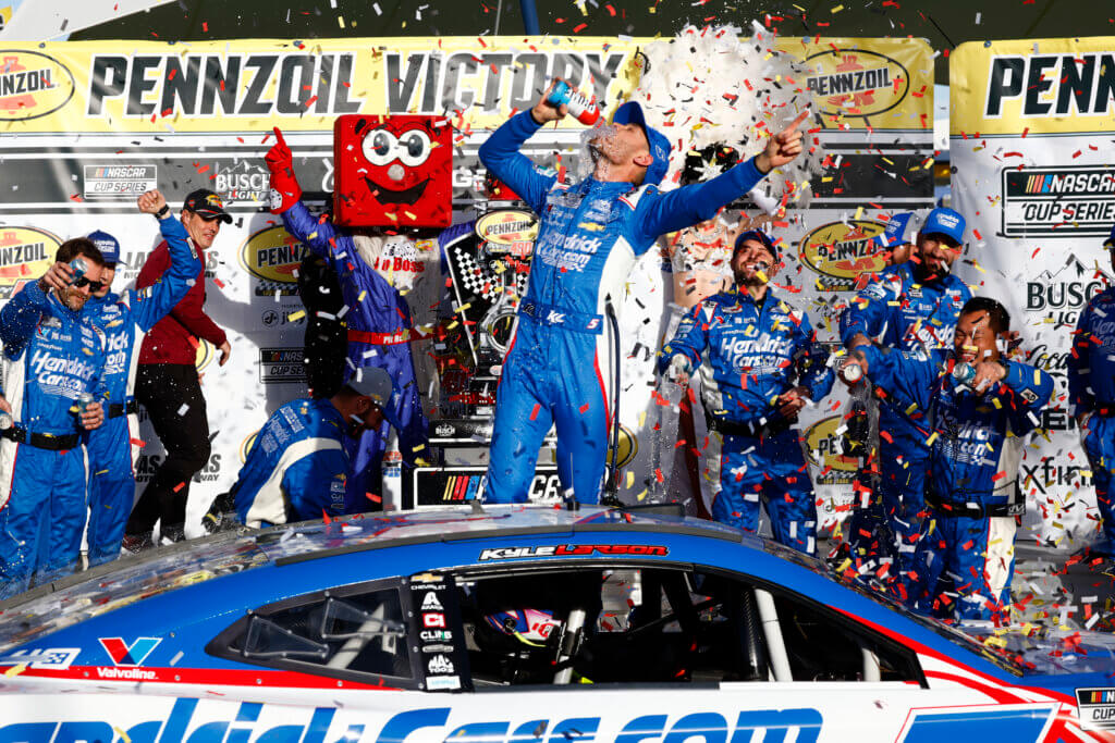 LAS VEGAS, NV - MARCH 03: Kyle Larson (#5 HendrickCars.com Hendrick Motorsports Chevrolet) celebrates in Victory Lane after winning the Pennzoil 400 presented by Jiffy Lube NASCAR Cup Series race on March 3, 2024, at Las Vegas Motor Speedway in Las Vegas, NV. (Photo by Jeff Speer/LVMS/Icon Sportswire)