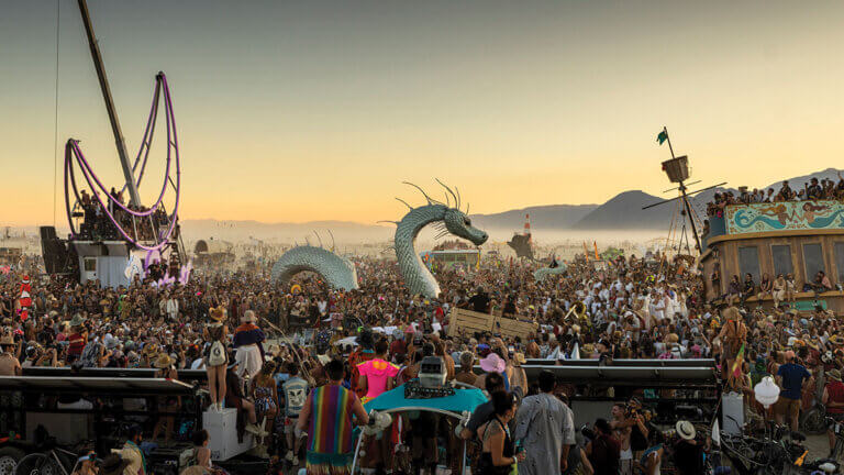 burning man art and attendees on the black rock playa in nevada