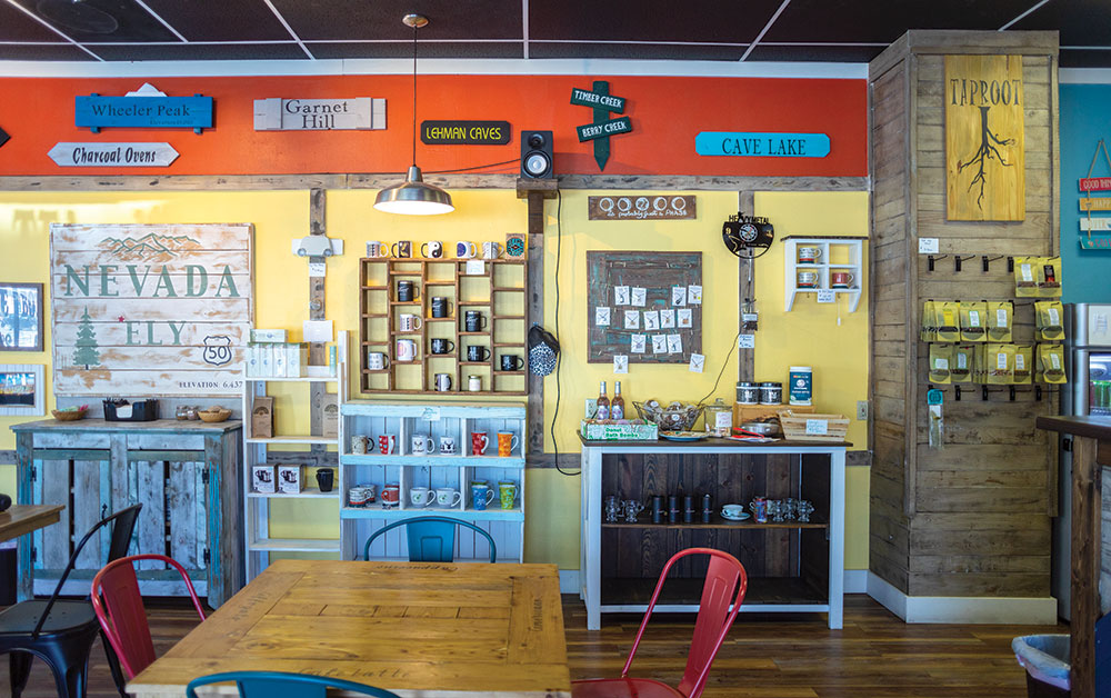The interior of Taproot, filled with road signs and local art for sale