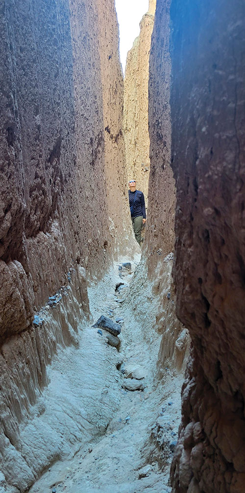 A person walks through the slot canyons at Cathedral Gorge State Park