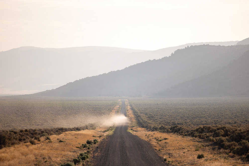 Car driving down SR 34 towards Sheldon National Wildlife Refuge.