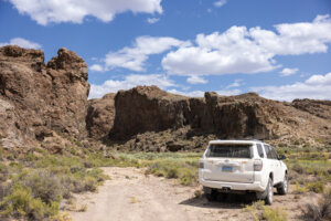 Car in front of Thousand Creek Gorge.