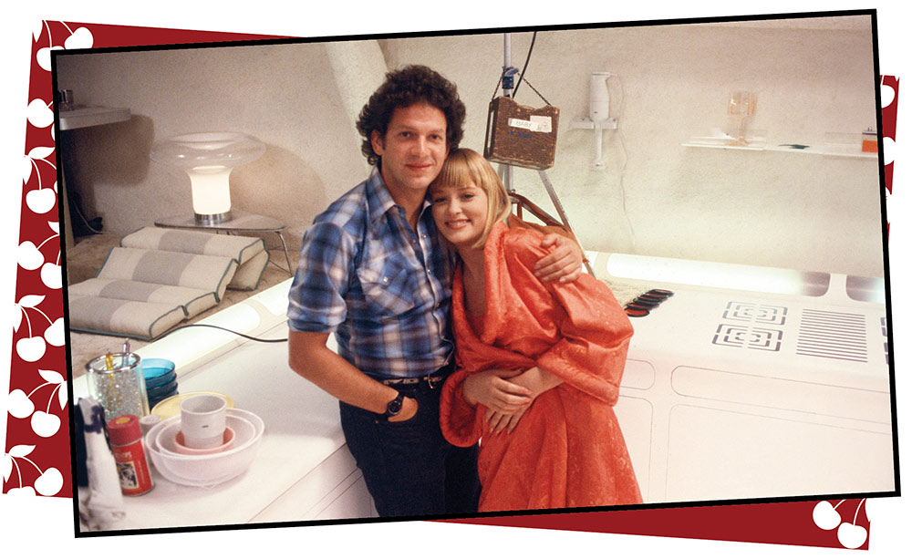 Director Steve De Jarnatt side-hugs Pamela Gidley, who played Cherry, on one of the sets. ©provided by Gail Adler - courtesy of Annie and Sam Pressman and the Pressman Archives at The Academy of Motion Pictures Library