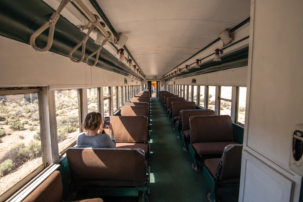 Woman sitting on a train.