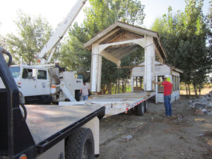 Structure of the gas station being offloaded a truck at the Fish Lake Valley Heritage Center and Museum.