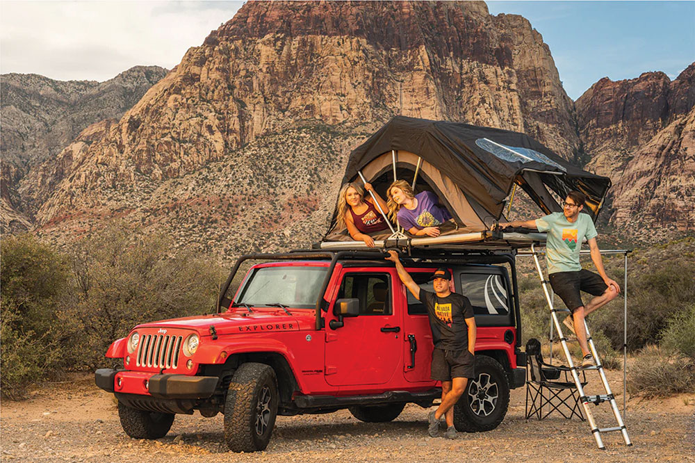 A group of people wearing Home Means Nevada clothing, camping in the desert