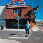Woman walking outside J.M. Capriola Co.