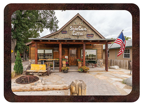 The exterior of Stone Cabin Coffee, with an American Flag displayed