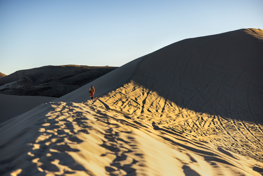 Woman walking on Sand Mountain.
