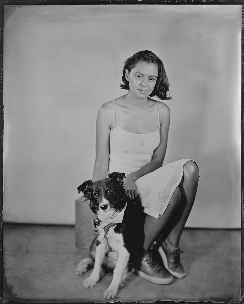 Myron Hensel tintype portrait, black and white of a girl with a dog.