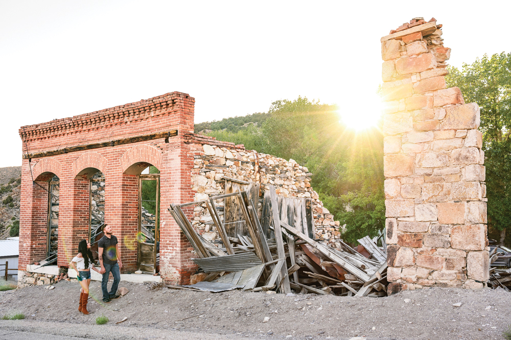 Man and woman walking amongst the ruins of Belmont.