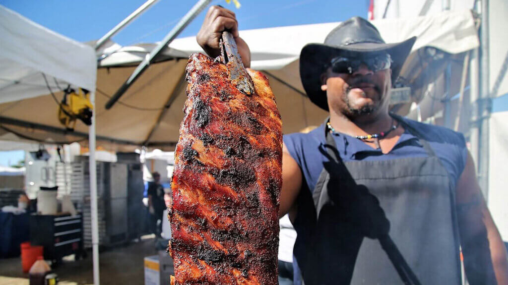 man with rack of ribs at best in the west nugget rib cookoff in sparks nv