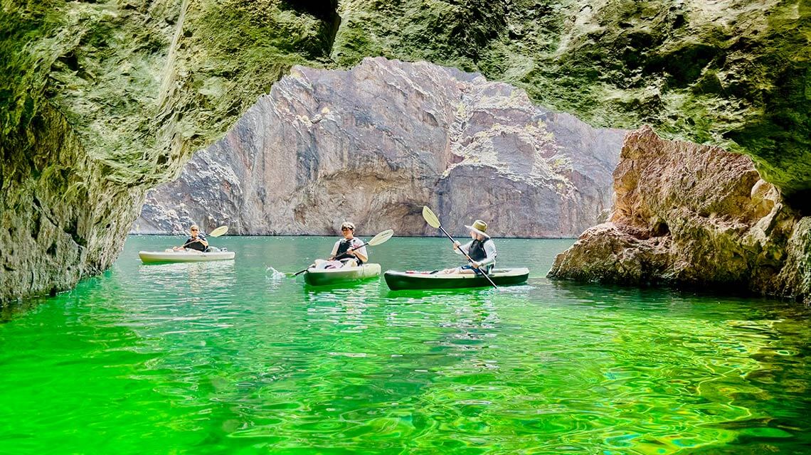 three kayakers at emerald cave nevada with trek las vegas kayaking tours and rentals