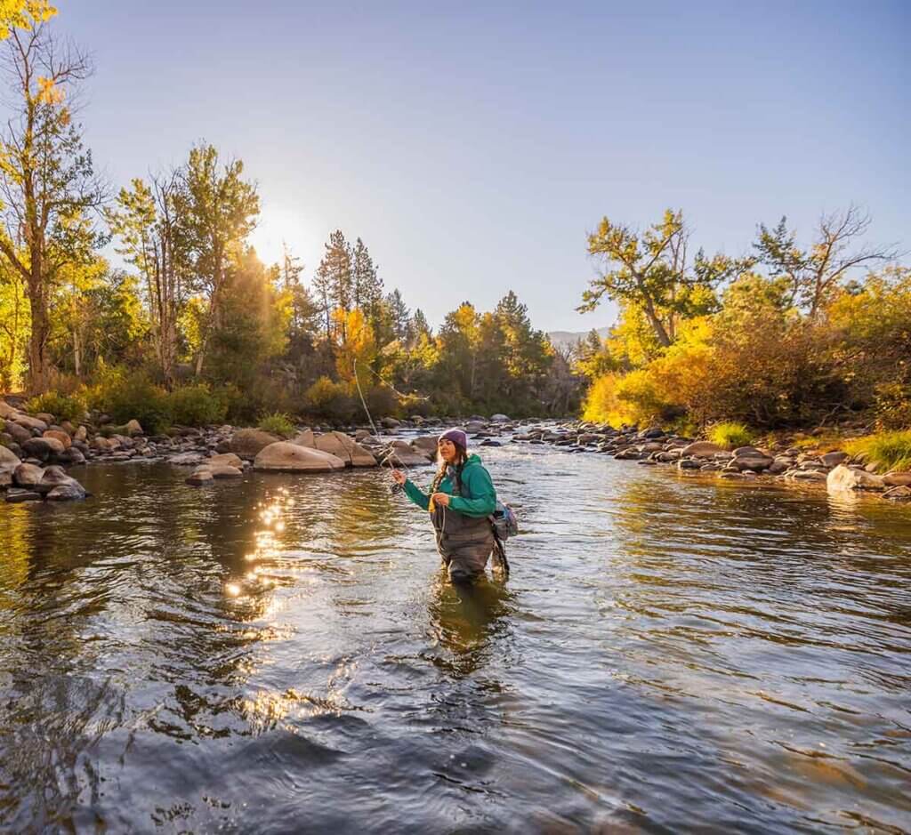woman fly fishing in truckee river