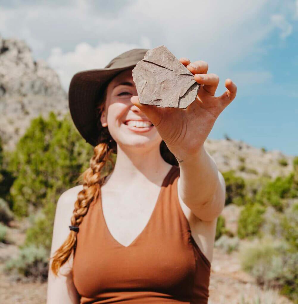 woman holding trilobite from oak springs