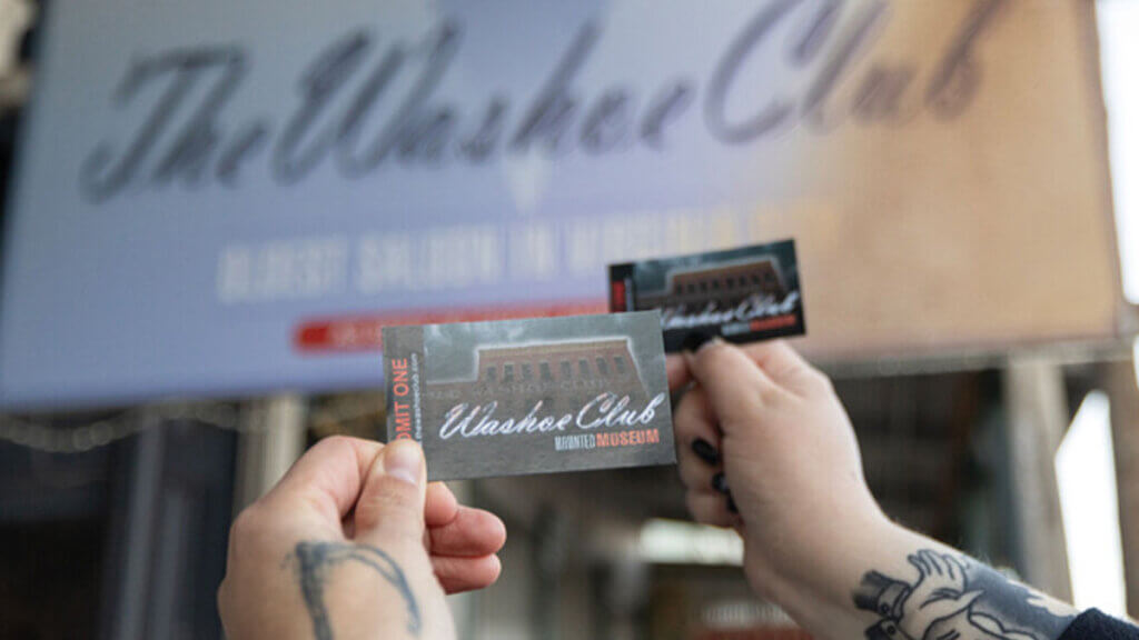 friends holding entry tickets to the washoe club