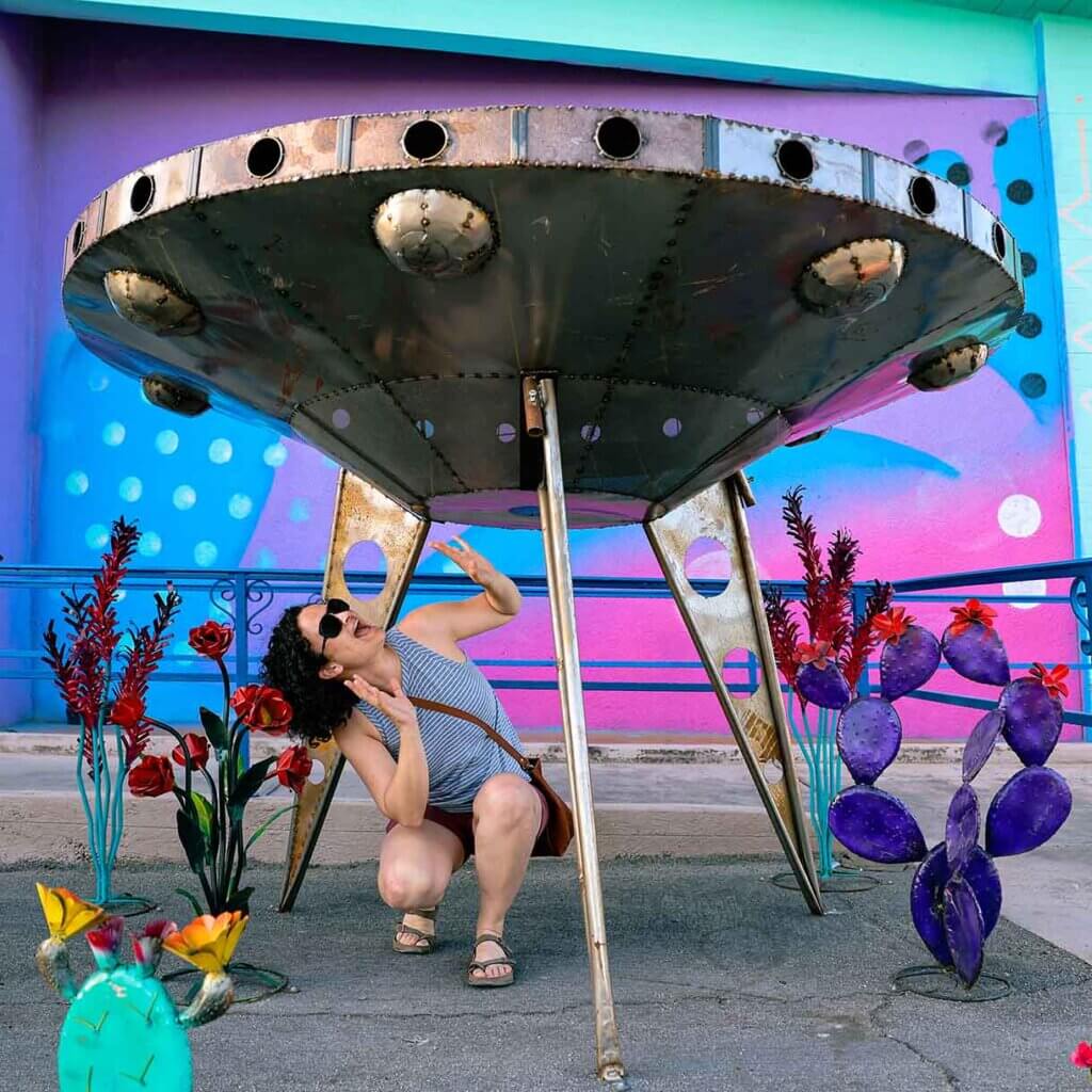 woman at las vegas art district 18b posing by UFO sculpture