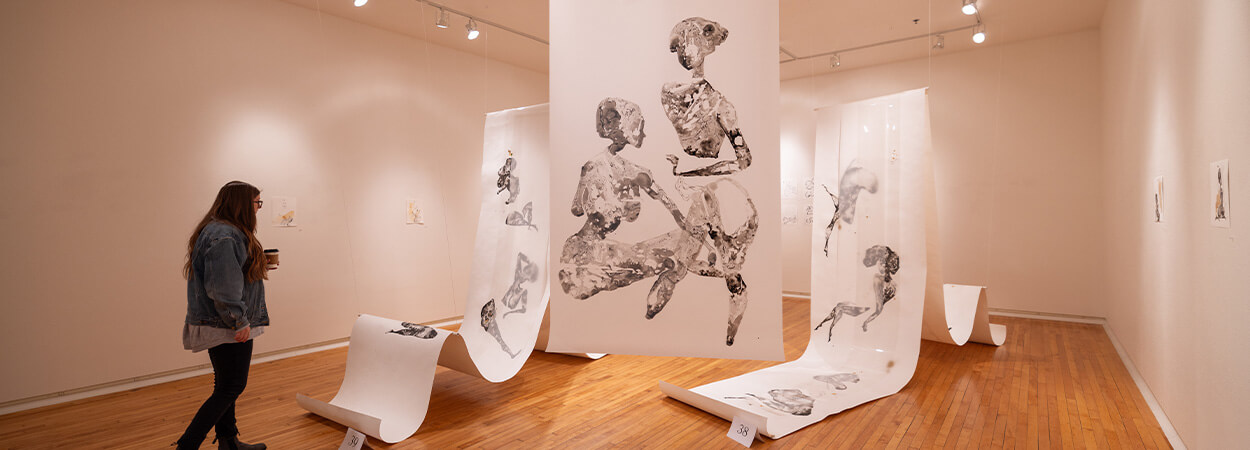 woman viewing artwork at oats parks art center
