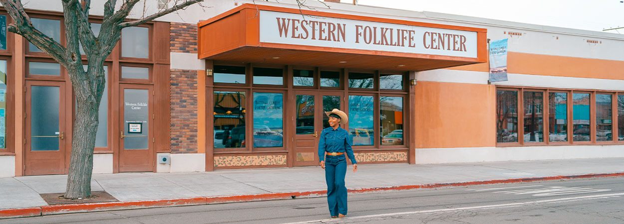 woman walking by western folklife center in elko