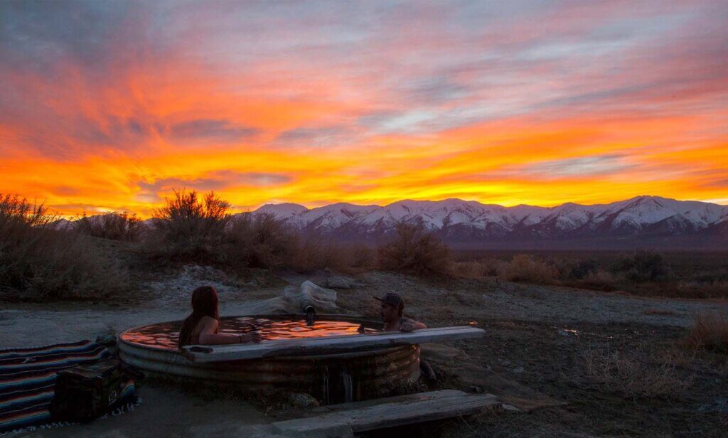 couple at spencer hot spring during sunset