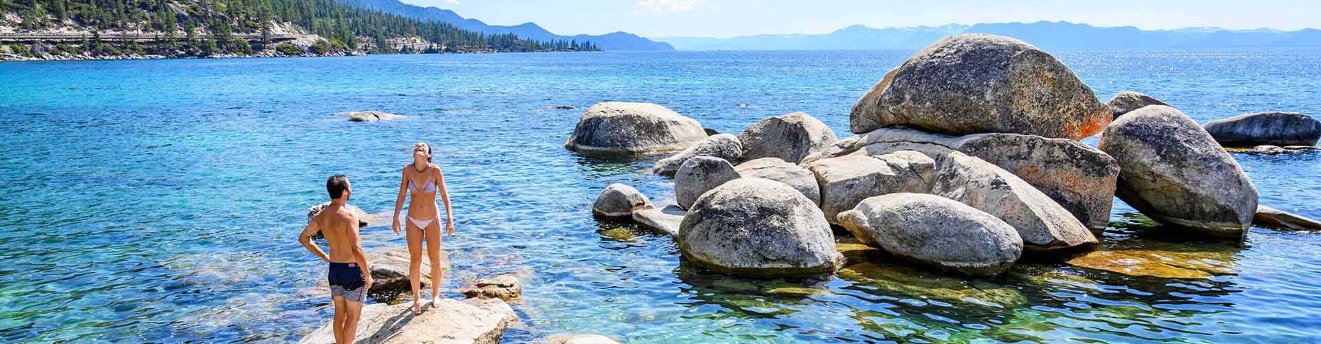 couple swimming at lake tahoe beach