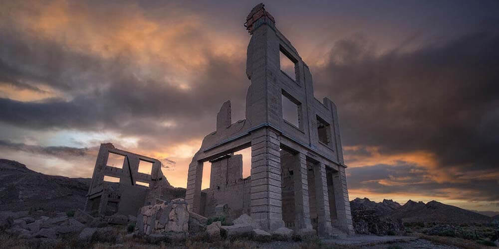 view of rhyolite ghost town ruin at dusk