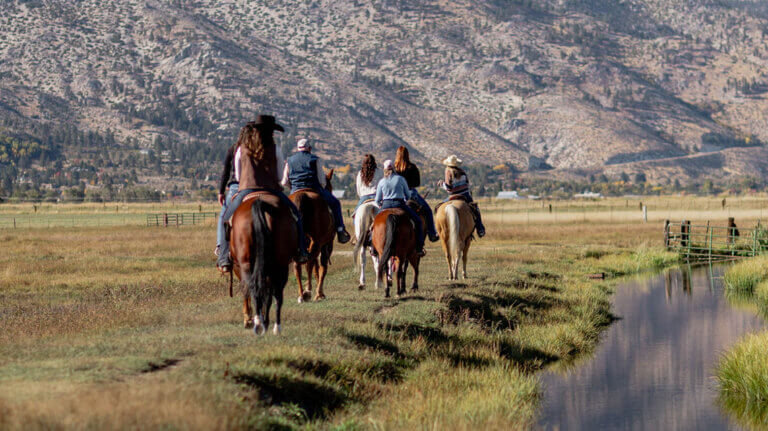 a group of horseback riders with bader ranch trail co in gardnerville nevada