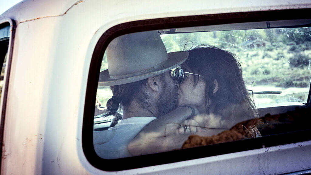 couple kissing in a pickup truck in nevada
